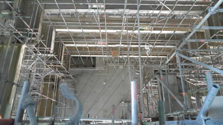 Vacuum cleaner on wooden floor

