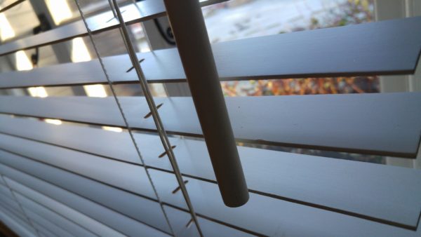 Vacuum cleaner on wooden floor

