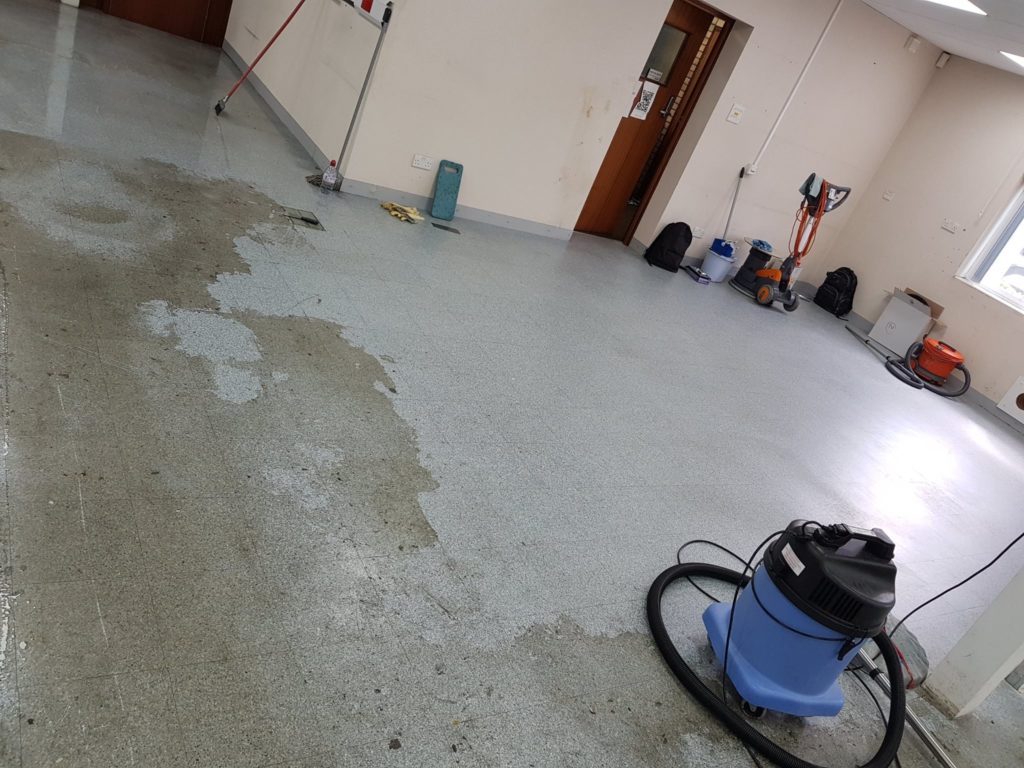 Vacuum cleaner on wooden floor

