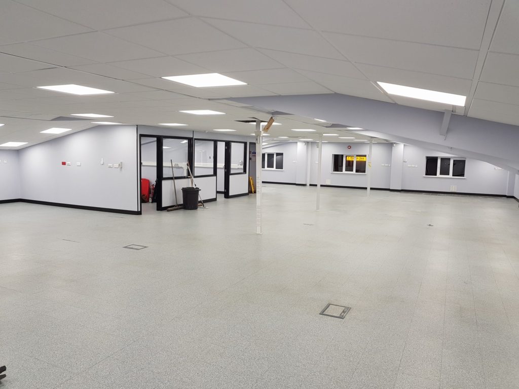 Vacuum cleaner on wooden floor

