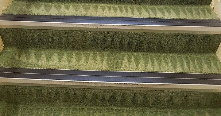 Vacuum cleaner on wooden floor

