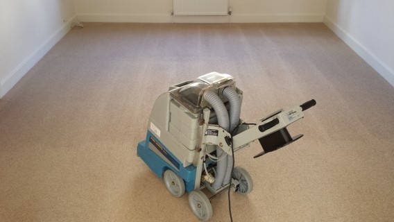 Vacuum cleaner on wooden floor

